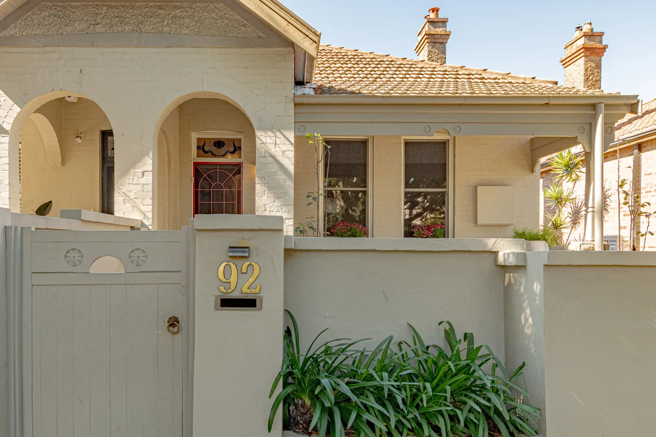 Character home facade with arched veranda and front garden in Manly